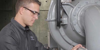 carrier-technician-working-on-hvac-equipment