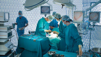 carrier-doctors-operating-in-hospital-operating-room