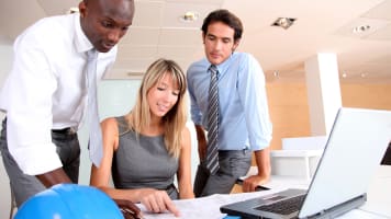 carrier-people-reviewing-documents-with-computer