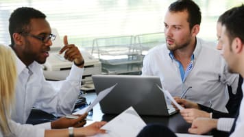 carrier-group-of-young-people-working-around-table