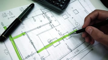 carrier-engineer-working-on-blueprint-document