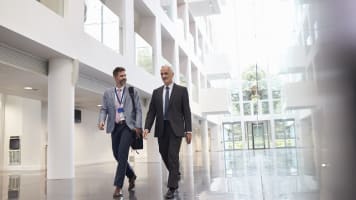 carrier-two-men-walking-in-building-lobby