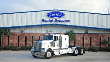 carrier-rentals-truck-in-front-of-rental-depot-card
