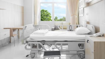 carrier-hospital-room-with-beds-and-equipment-card