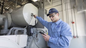 carrier-technician-evaluating-hvac-equipment