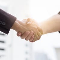 two-people-shaking-hands