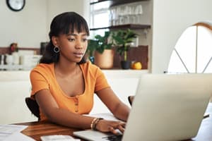 woman-looks-on-computer-for-savings-3x2