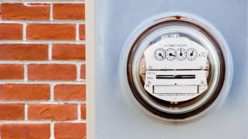 utility-electric-meter-on-the-side-of-a-house