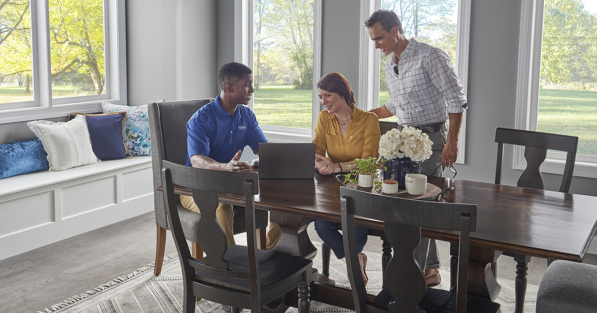 a dealer explains to a couple why a furnace is not turning on