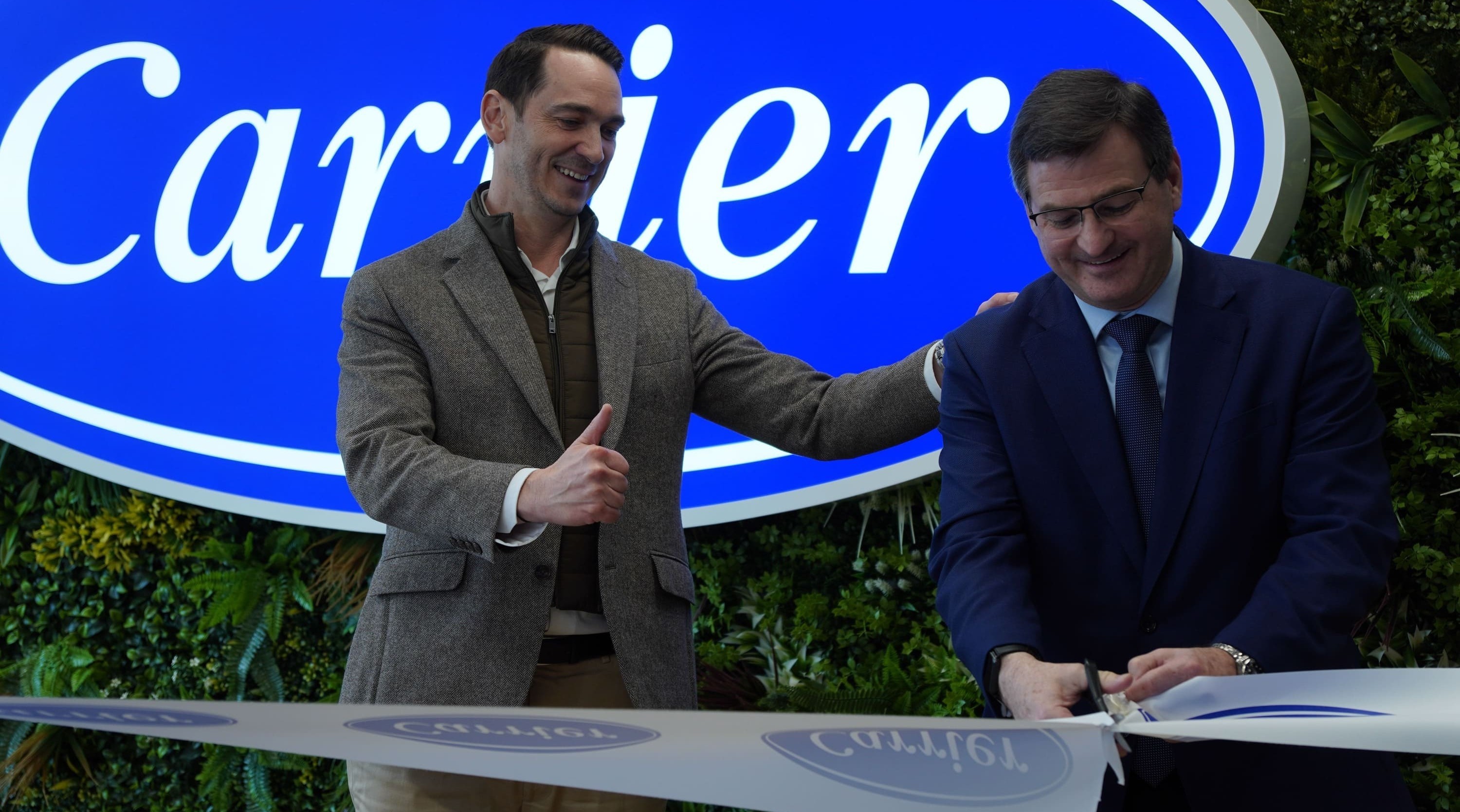 bertrand-rotagnon-and-andrew-paddock-cutting-the-ribbon-to-open-the-new-office