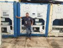 Dittmer_President_Darin_working_on_the_marina_containers. Dittmer_President_Darin_working_on_the_marina_containers.