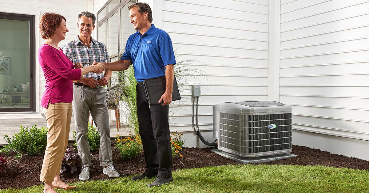 a-carrier-dealer-shakes-a-woman_s-hand-after-performing-hvac-service