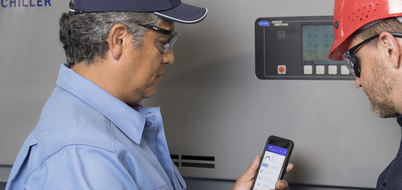 carrier-service-technicians-looking-at-mobile-phone-sm