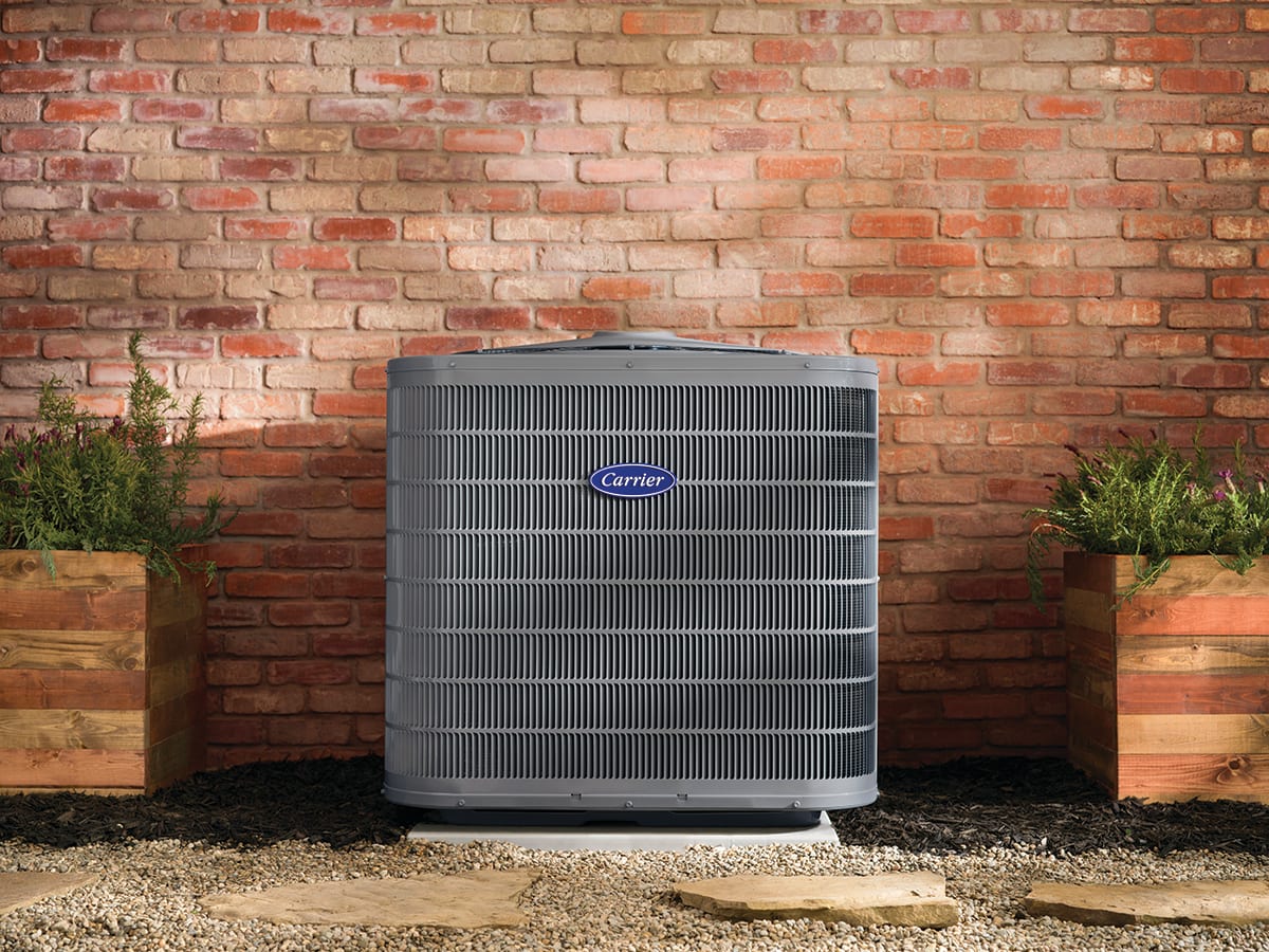 a carrier air conditioner sits outside after air conditioner tune up
