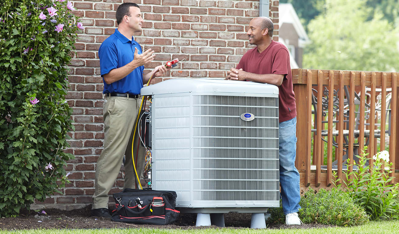 carrier dealer discusses hspf2 with homeowner
