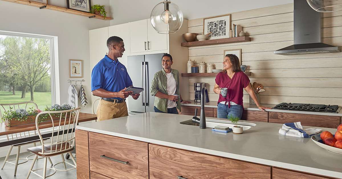 a carrier dealer explains hvac meaning and what is hvac with a couple