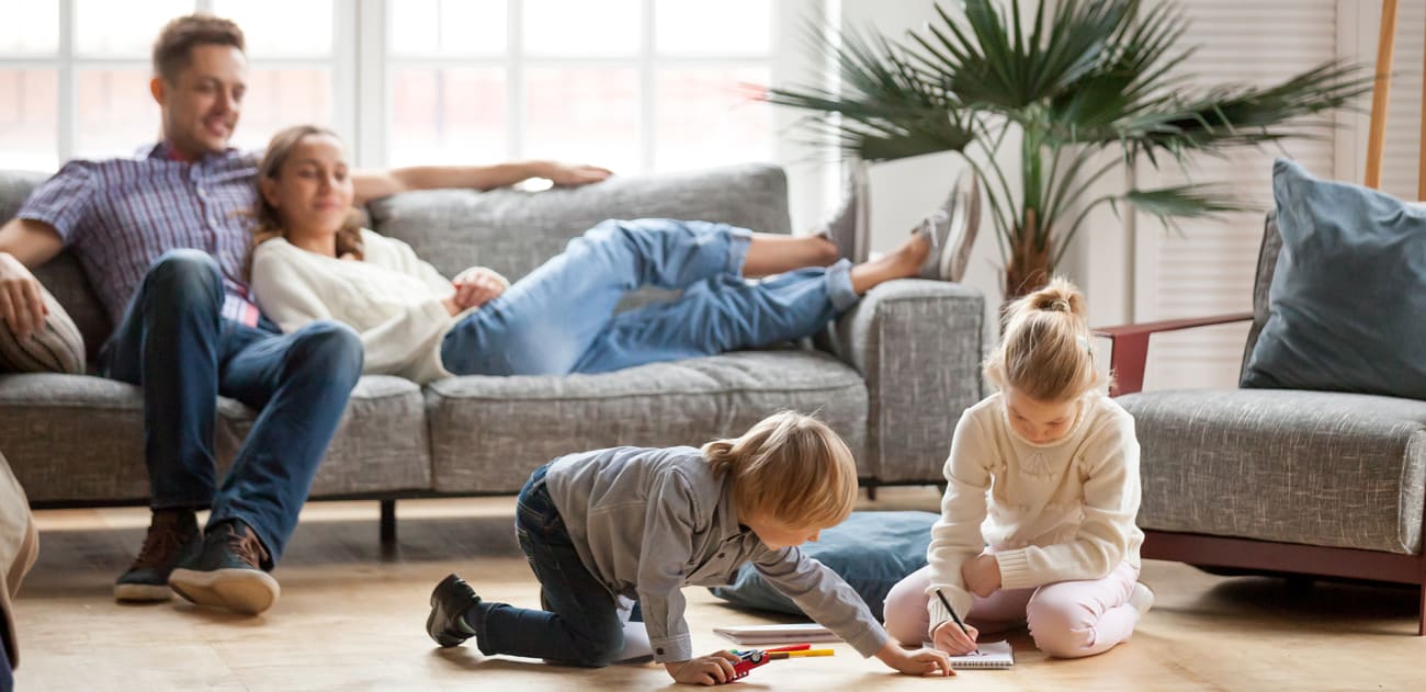 a family plays in the living room after ac tuneup