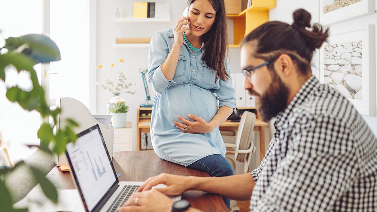 a man and woman research online at a desk whole house humidifier cost and whole house humidifier installation