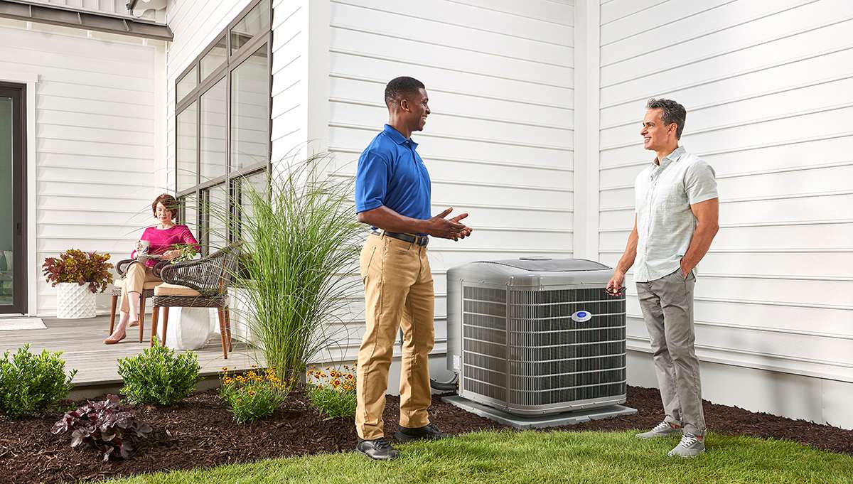 a carrier dealer tells a homeowner about energy efficiency ratio