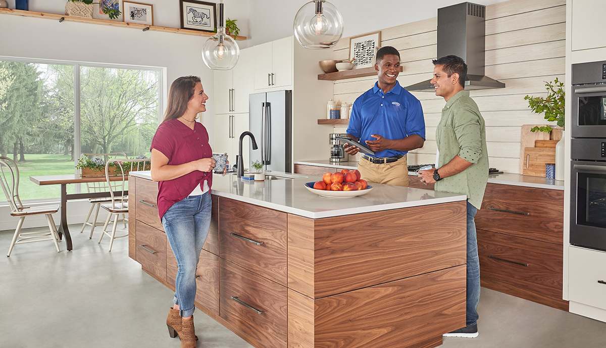 a carrier dealer discusses humidifiers for furnaces with a couple