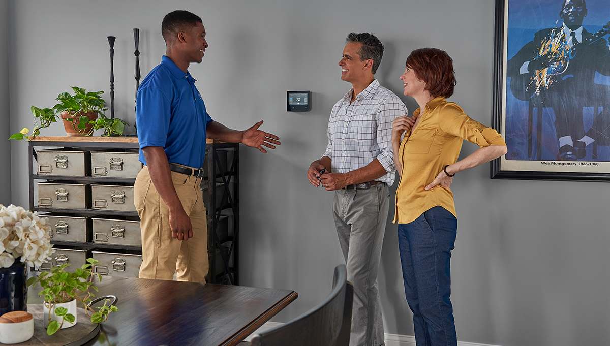 a carrier dealer discusses the importance of ac filters with homeowners