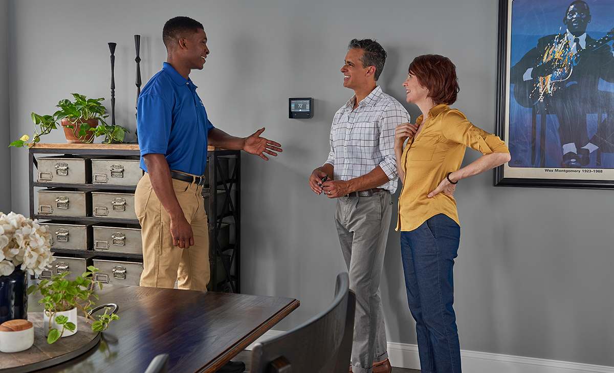 carrier dealer discusses best home humidifier options with homeowner