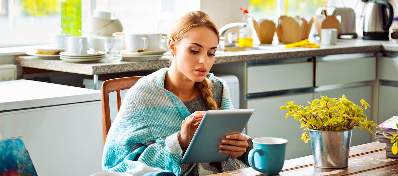 furnace blowing cold air on woman at table