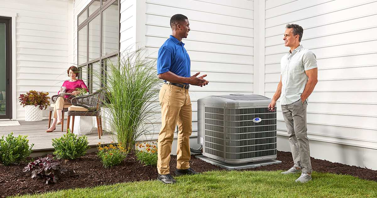 carrier technician explaining to a customer why they have an ac not cooling