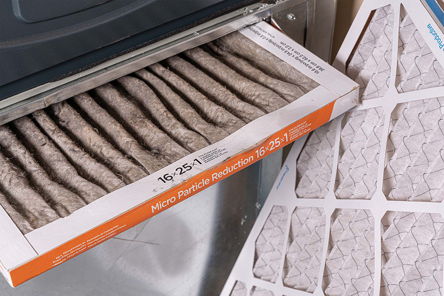 a homeowner changes an 8 merv rating air filter