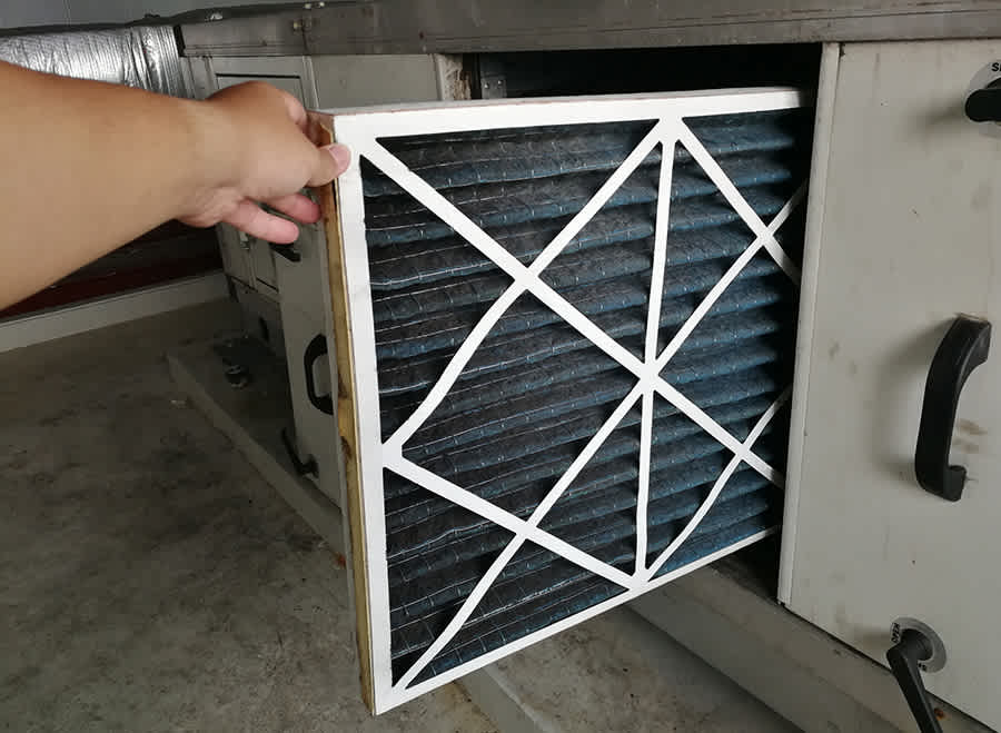 a homeowner performs ac filter replacement