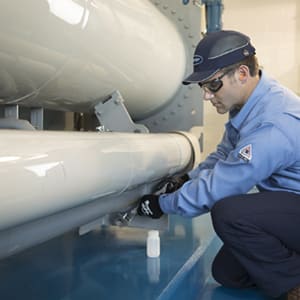 carrier-technician-testing-hvac-equipment-sq