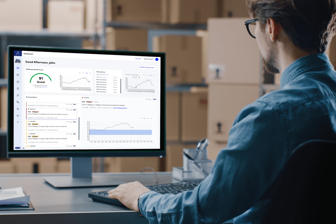 Carrier-innovation-man-looking-at-Abound-healthy-building-dashboard-3x2