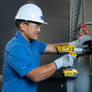 technician-with-drill-servicing-chiller-1x1