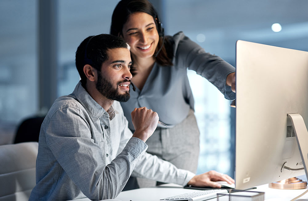 man and woman in office at training