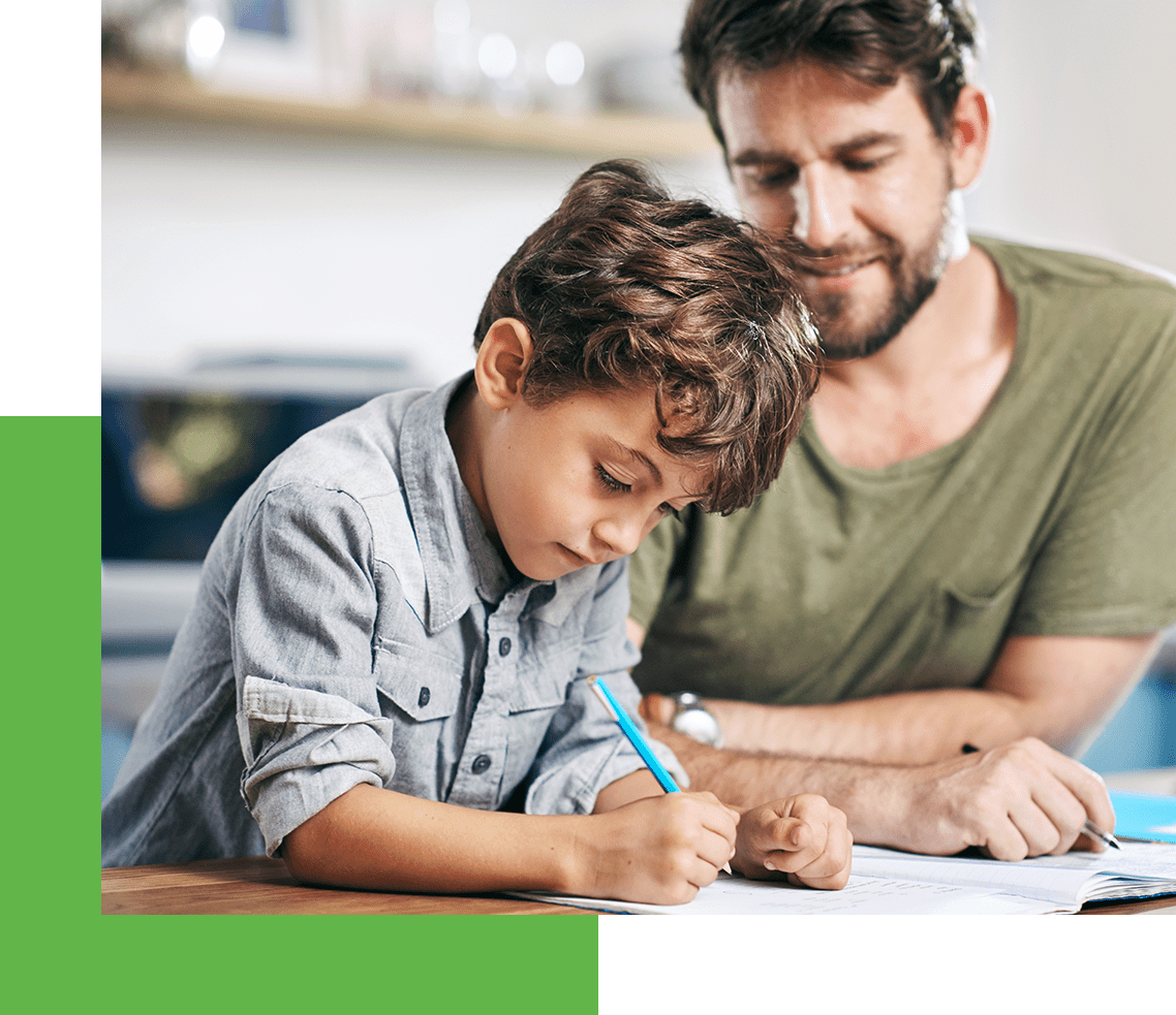 father and son do homework in home with new hvac system installed by carrier hvac company