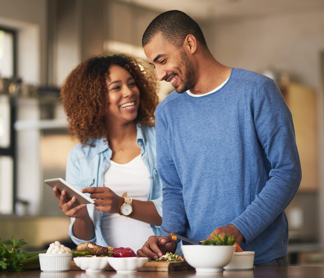 woman and man research hvac equipment and hvac system options on phone