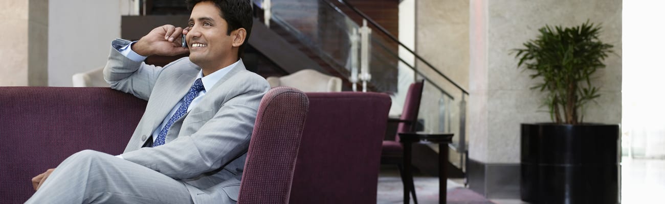 man-on-phone-office-building-lobby