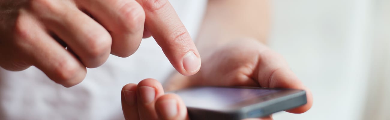 man-tapping-cell-phone