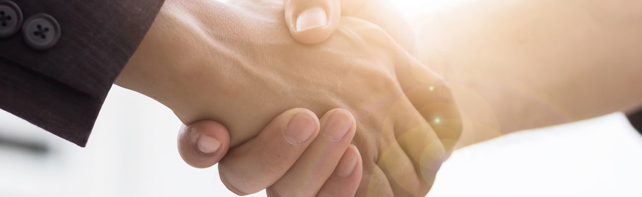 two-people-shaking-hands