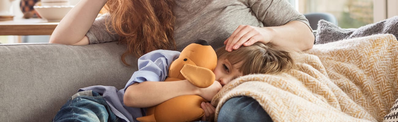 woman-and-child-relaxing-on-couch_sq