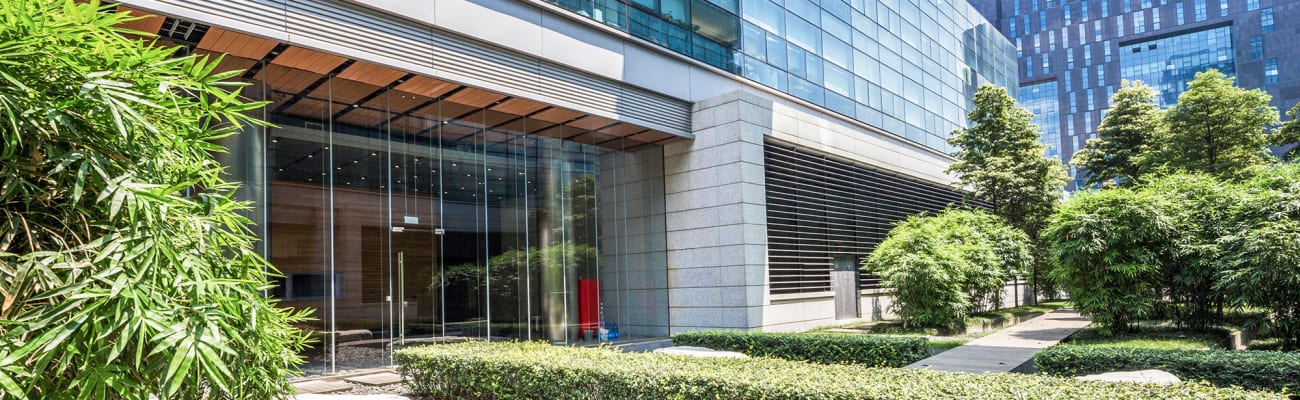 carrier-modern-building-exterior-courtyard-with-trees-and-shrubbery