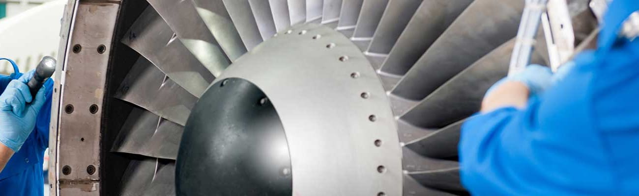Men-working-with-aircraft-engine
