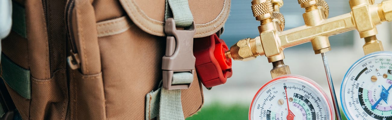 technician-holding-gauges-banner-image