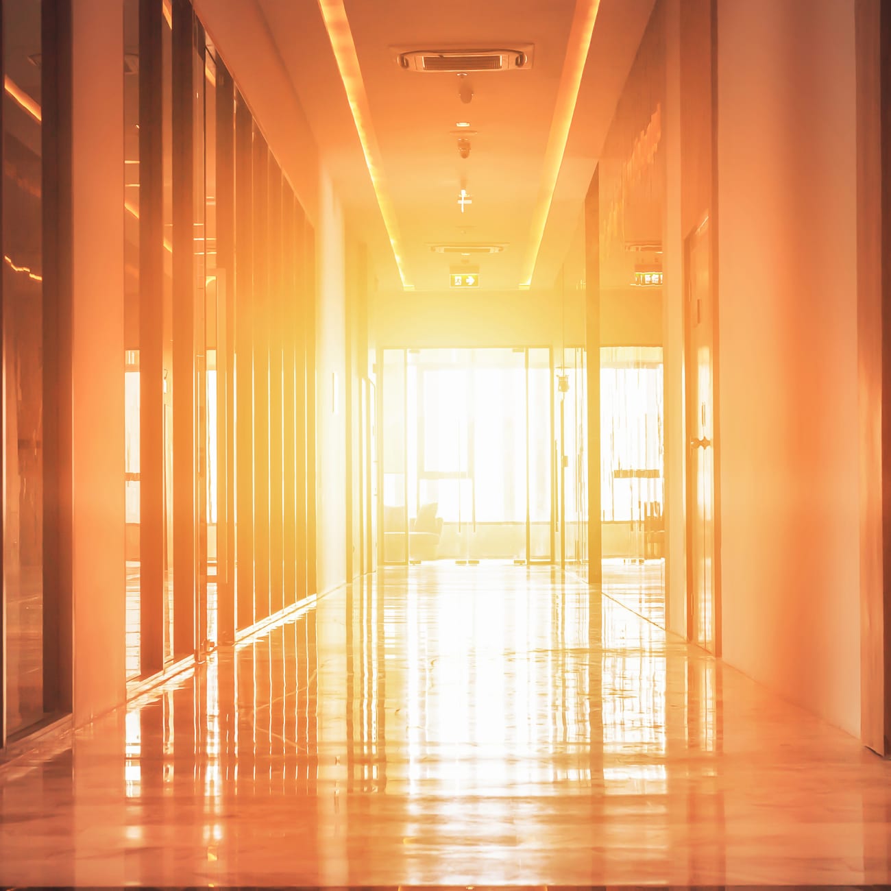 warmly-lit-hotel-hallway-1x1