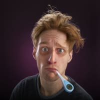 sick-man-with-thermometer
