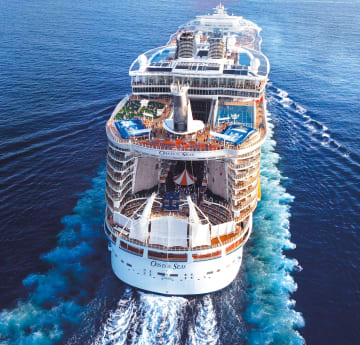 The stern of a sailing cruise ship, the Oasis of the Seas.