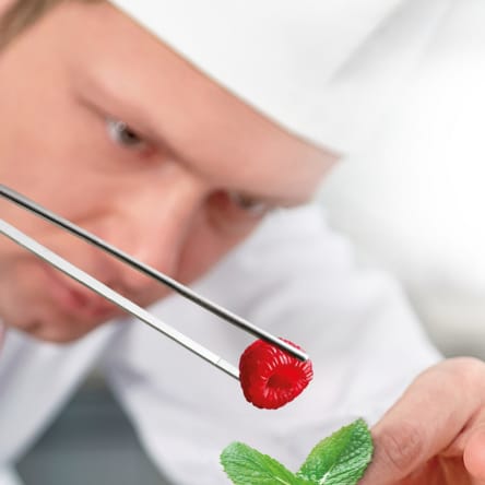 chef-placing-raspberry