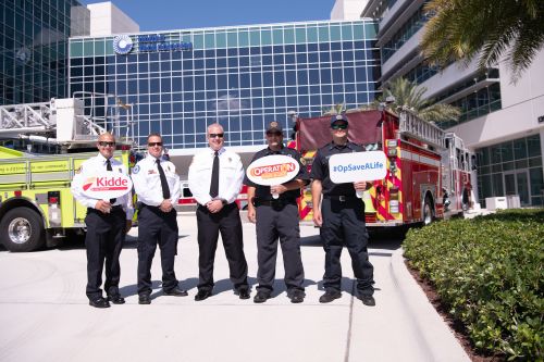 _TW88520 Palm Beach County firefighters pose for a photo in front of the Center for Intelligent Buildings.
