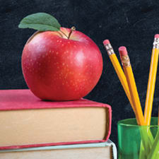 carrier-apple-sitting-on-books-with-pencils-sm