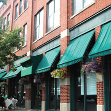 carrier-outdoor-brick-storefronts-with-green-awnings-sm